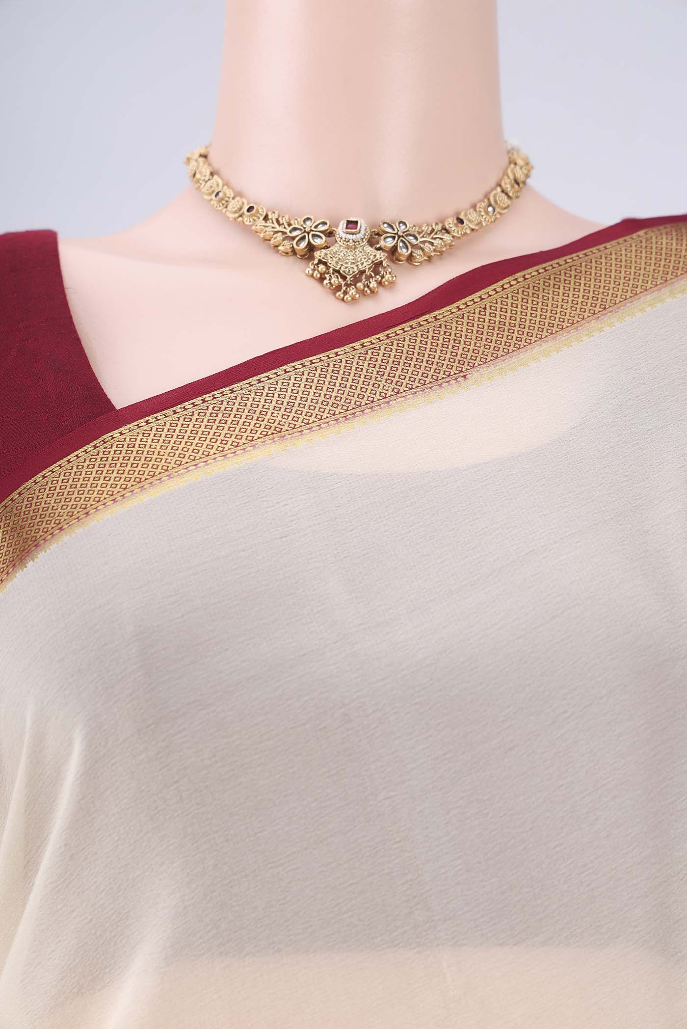 Border image of Off White Mysore Crepe Saree with Plain Body and Zari Border. 