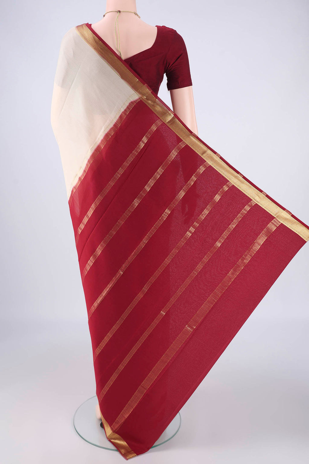 Flat view of Off White Mysore Crepe Saree with Plain Body and Zari Border. 
