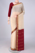 Cream Mysore Crepe Saree with Plain Body and Zari Border.  displayed on a mannequin