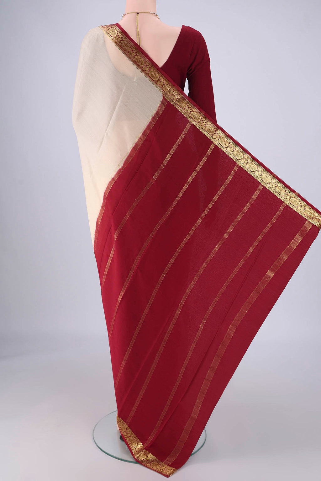 Flat view of Cream Mysore Crepe Saree with Plain Body and Zari Border. 