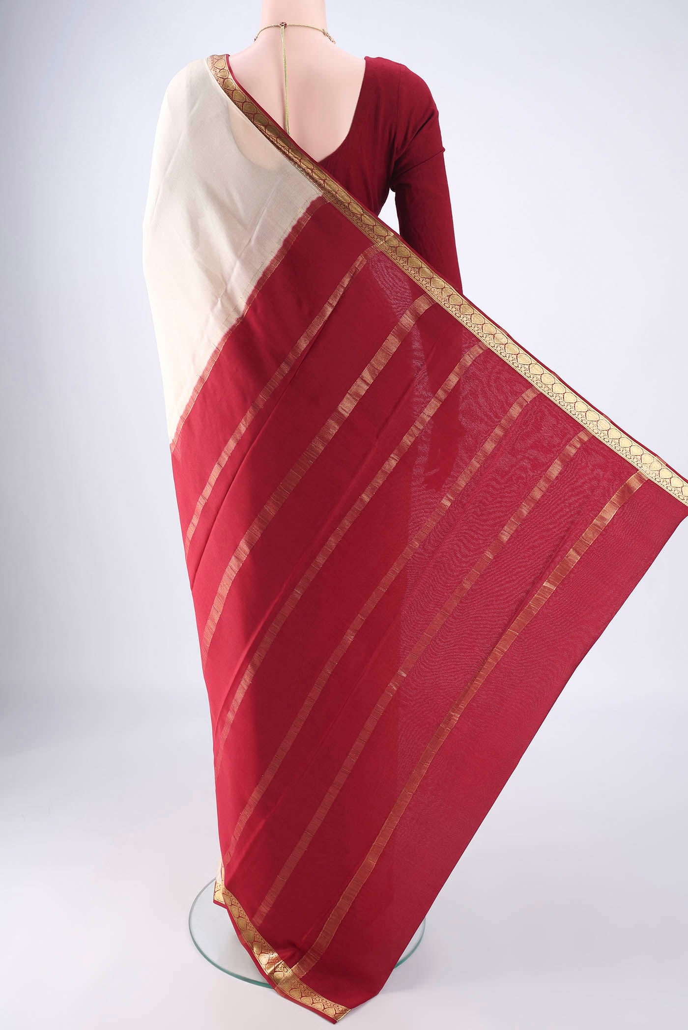 Flat view of Cream Mysore Crepe Saree with Plain Body and Zari Border. 
