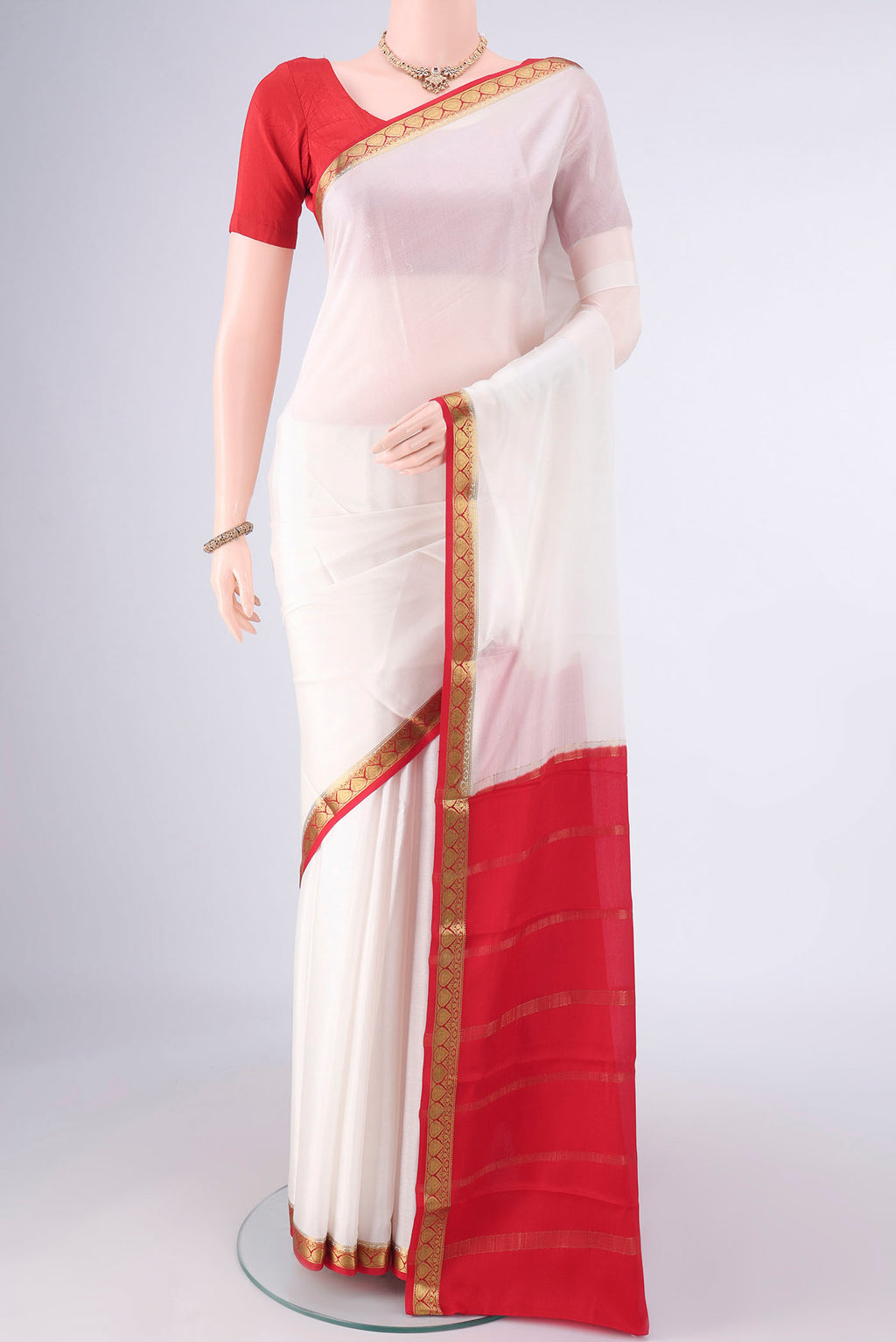 Off White Mysore Crepe Saree with Plain Body and Zari Border.  displayed on a mannequin