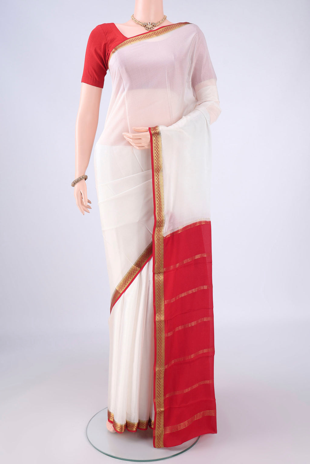White Mysore Crepe Saree with Plain Body and Zari Border.  displayed on a mannequin