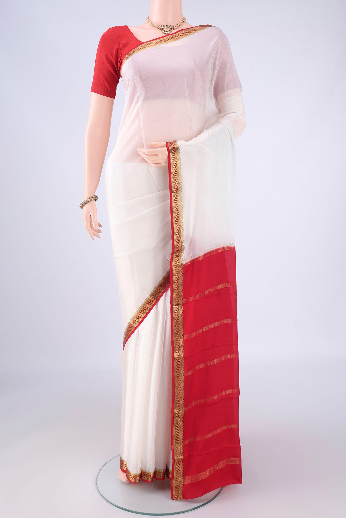 White Mysore Crepe Saree with Plain Body and Zari Border.  displayed on a mannequin