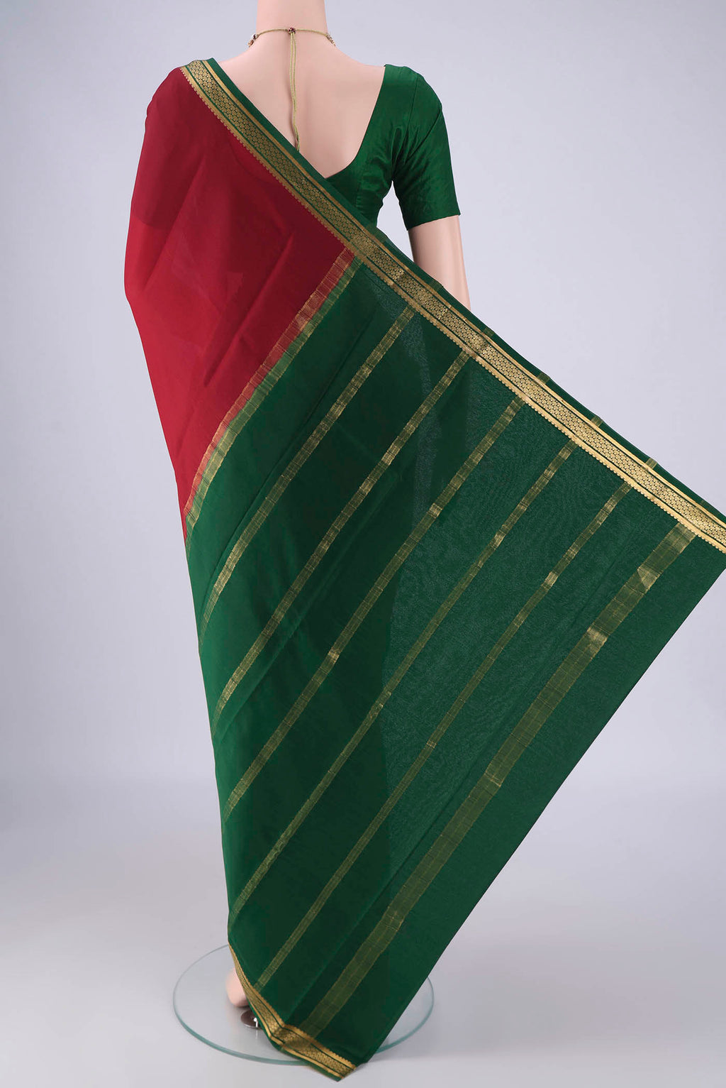 Flat view of Maroon Mysore Crepe Saree with Plain Body and Zari Border. 