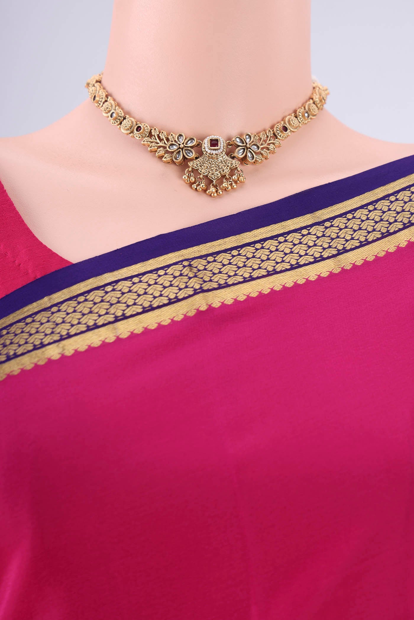 Border image of Rani Pink Mysore Crepe Saree with Plain Body and Zari Border. 