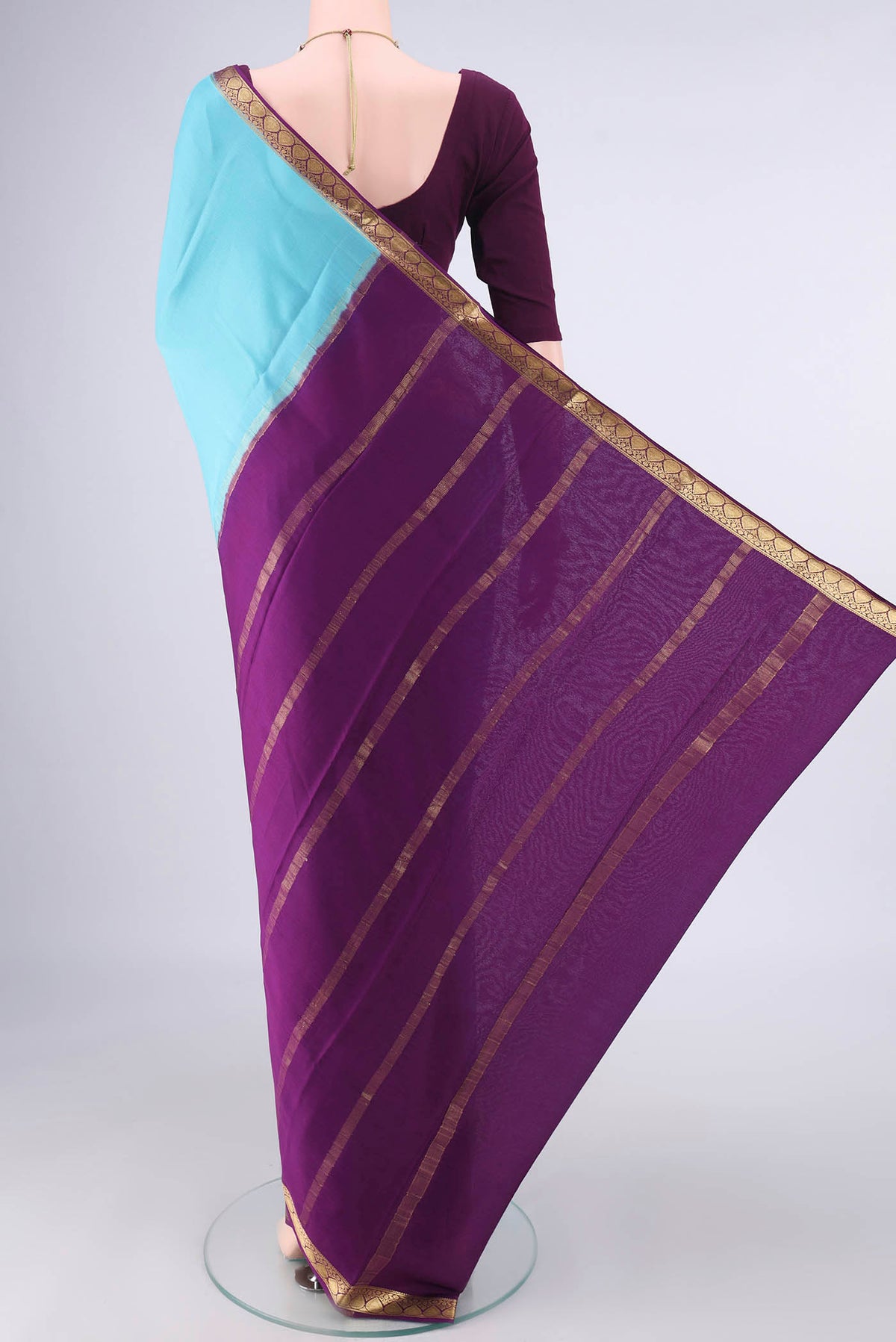 Flat view of Sky Blue Mysore Crepe Saree with Plain Body and Zari Border. 
