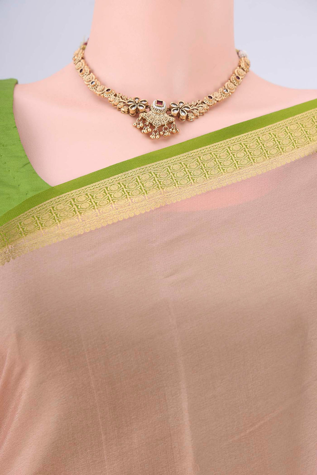 Border image of Golden Peach Mysore Crepe Saree with Plain Body and Zari Border. 
