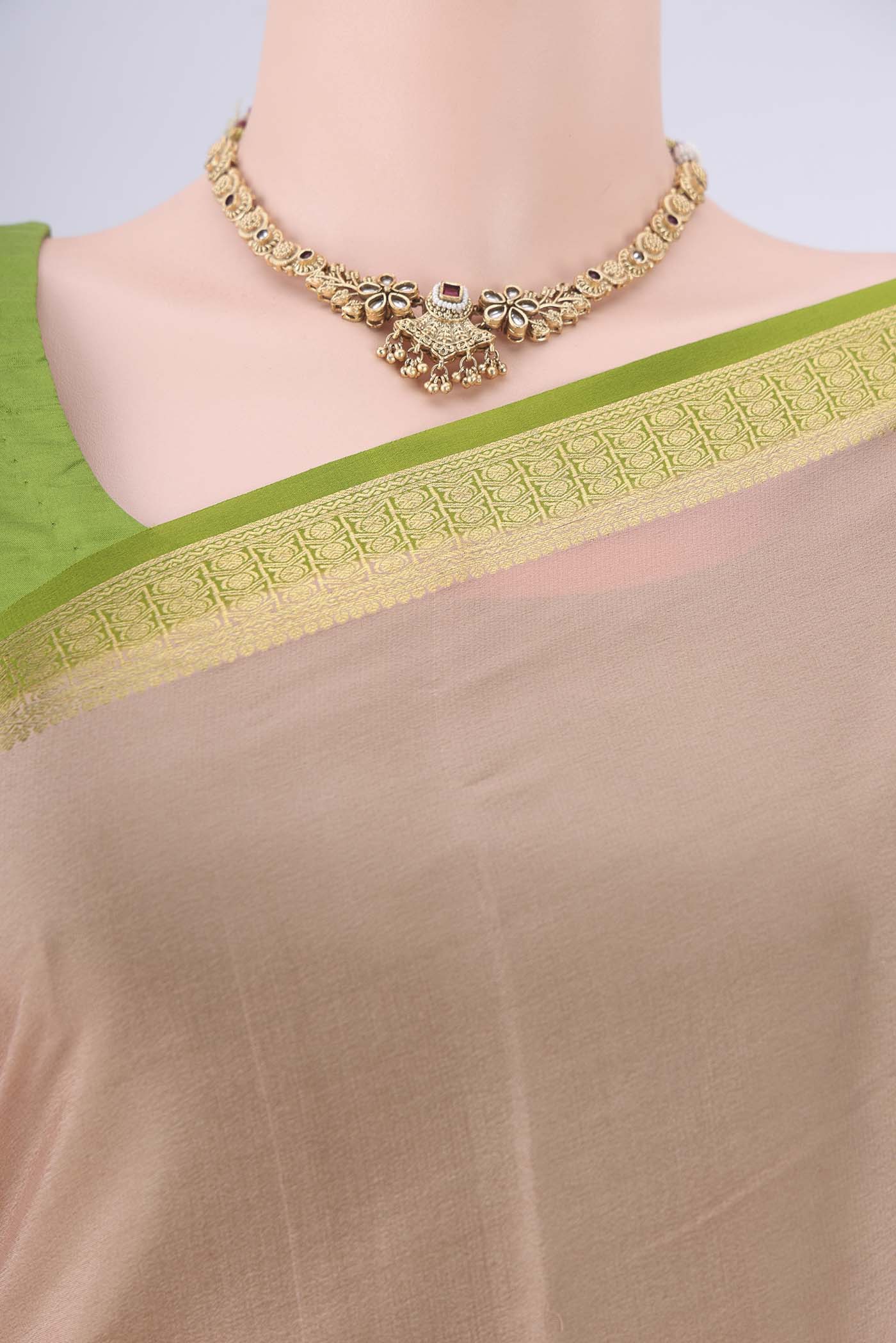 Border image of Golden Peach Mysore Crepe Saree with Plain Body and Zari Border. 