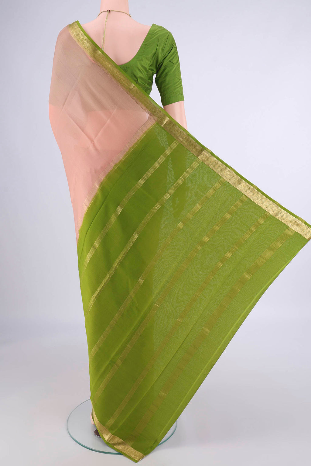 Flat view of Golden Peach Mysore Crepe Saree with Plain Body and Zari Border. 