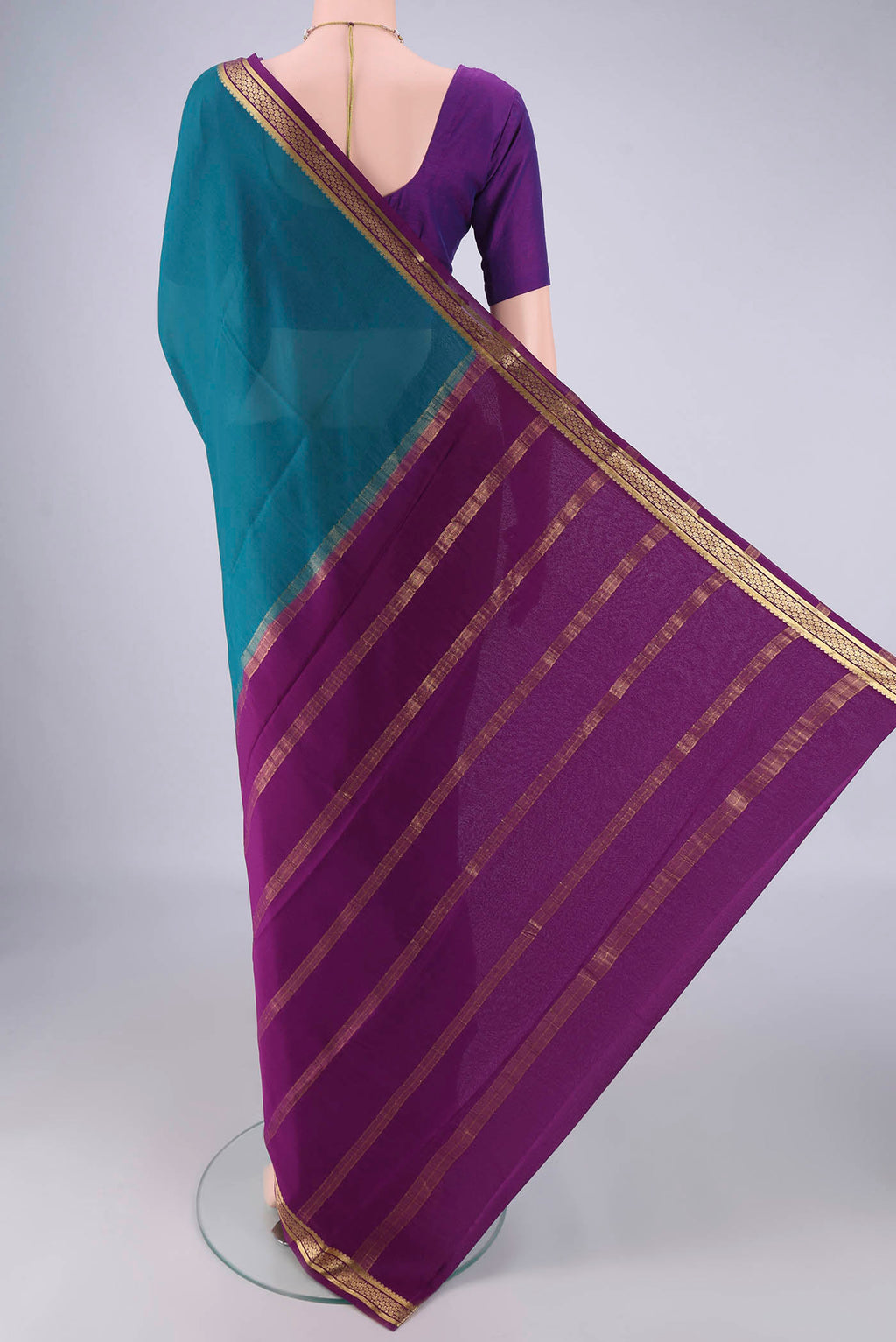 Flat view of Teal Mysore Crepe Saree with Plain Body and Zari Border. 