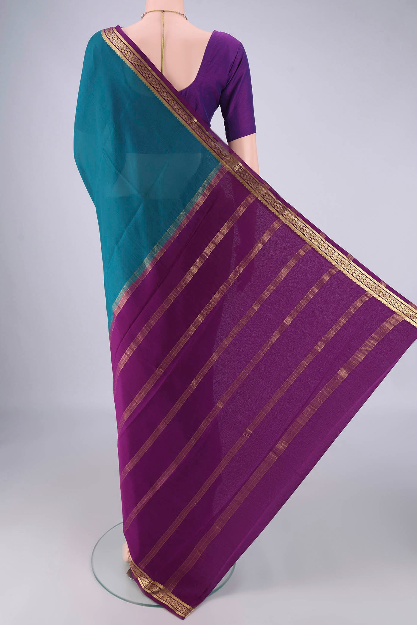 Flat view of Teal Mysore Crepe Saree with Plain Body and Zari Border. 