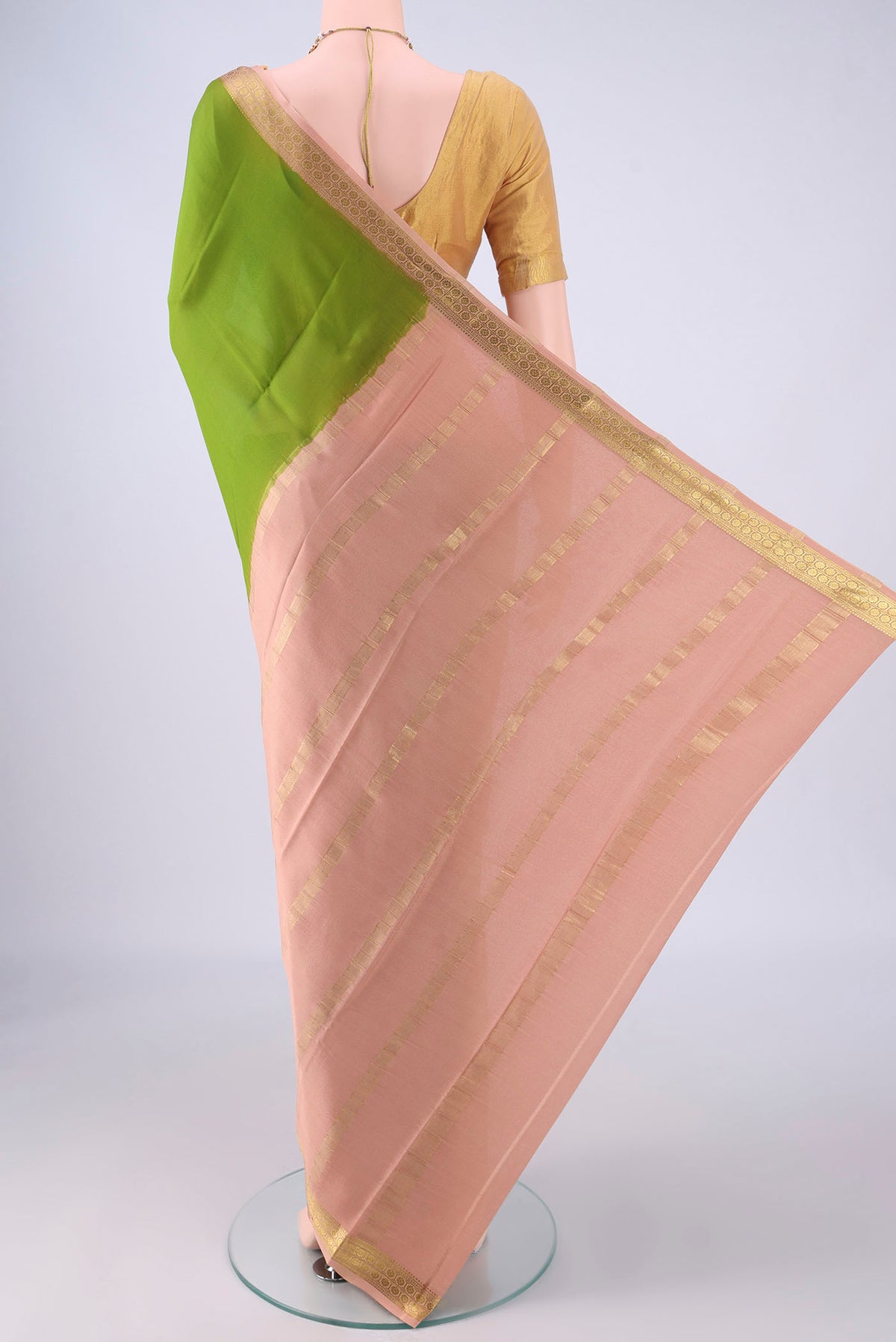 Flat view of Green Mysore Crepe Saree with Plain Body and Zari Border. 