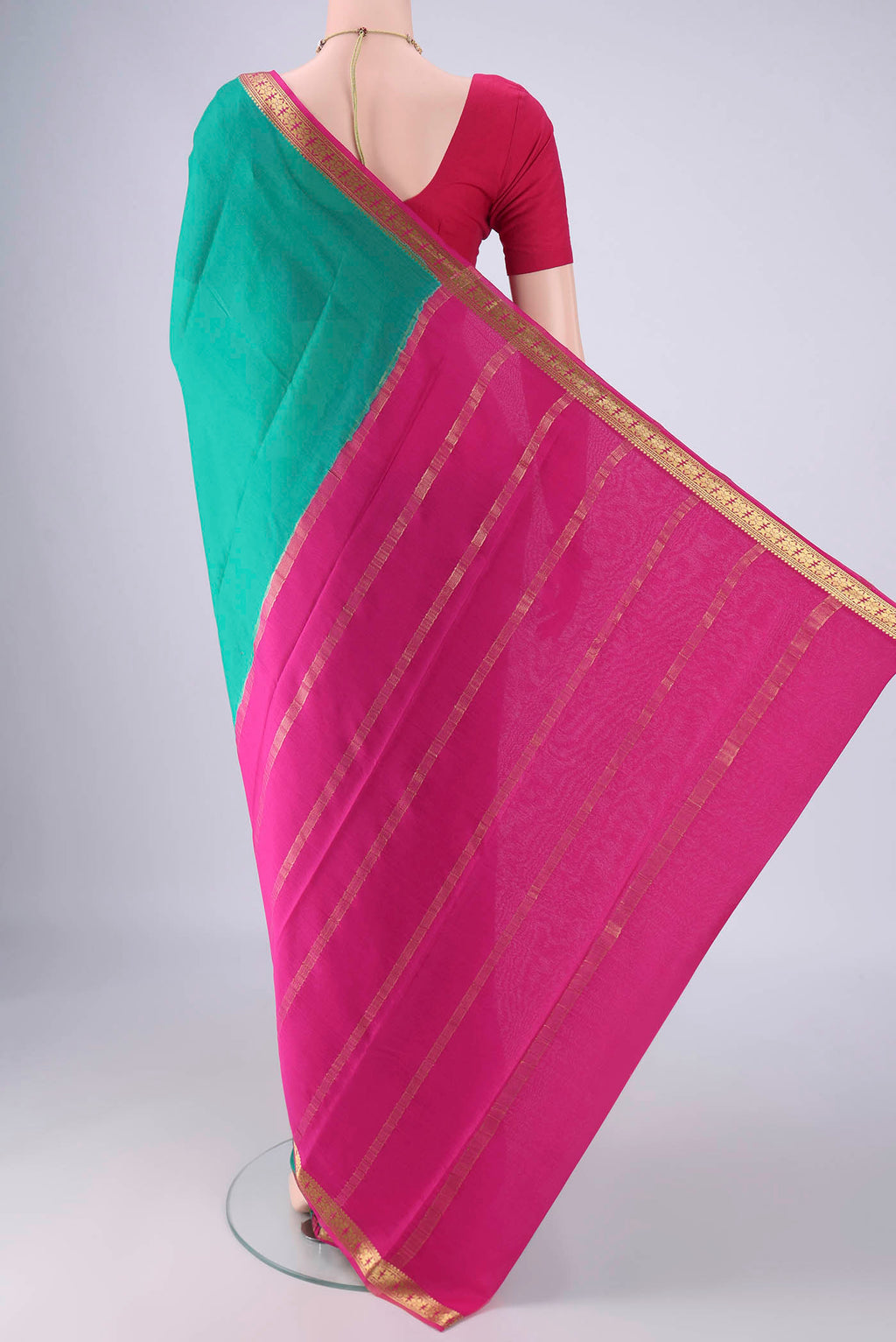Flat view of Sea Green Mysore Crepe Saree with Plain Body and Zari Border. 