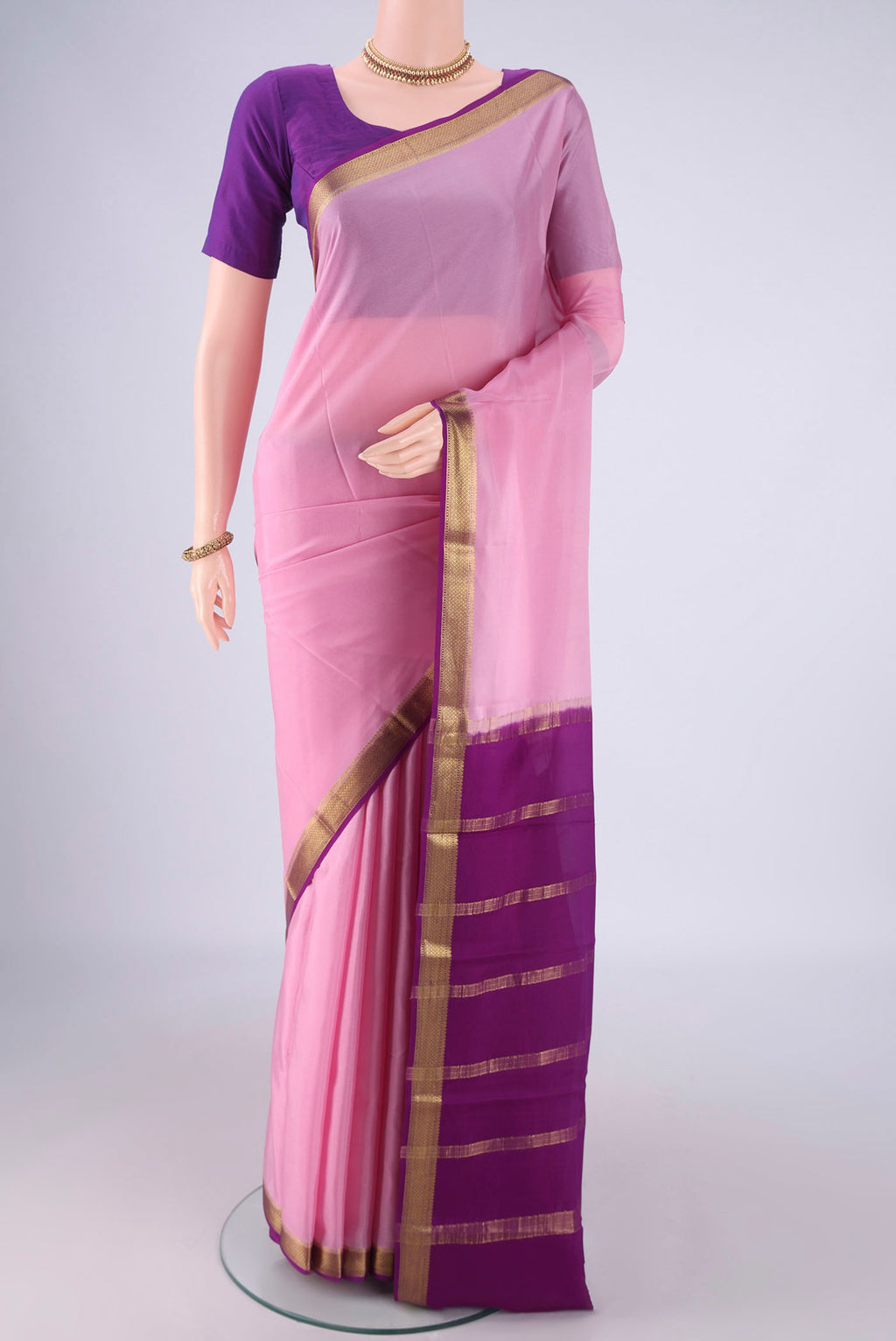 Pink Mysore Crepe Saree with Plain Body and Zari Border.  displayed on a mannequin
