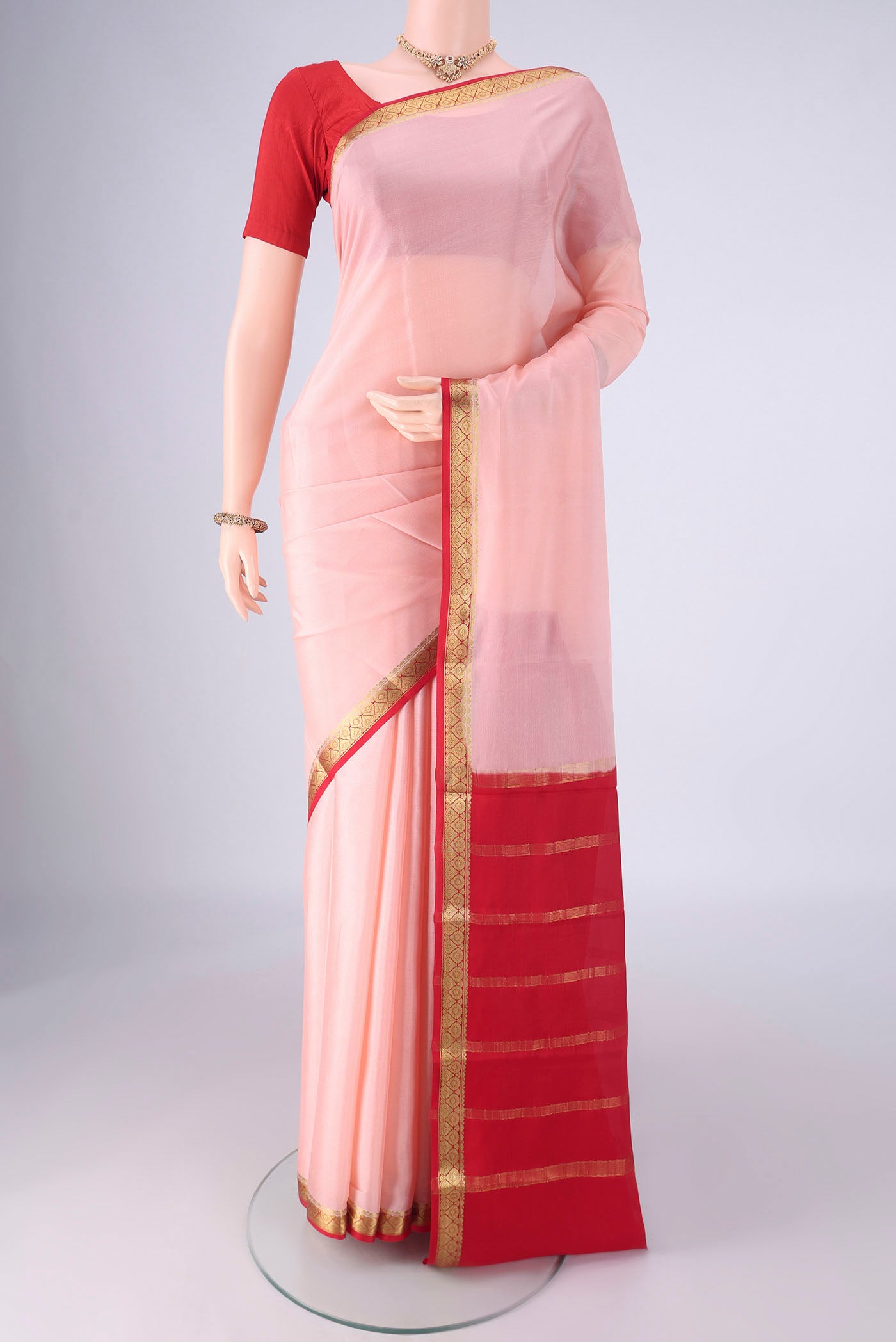 Rose pink Mysore Crepe Saree with Plain Body and Zari Border.  displayed on a mannequin