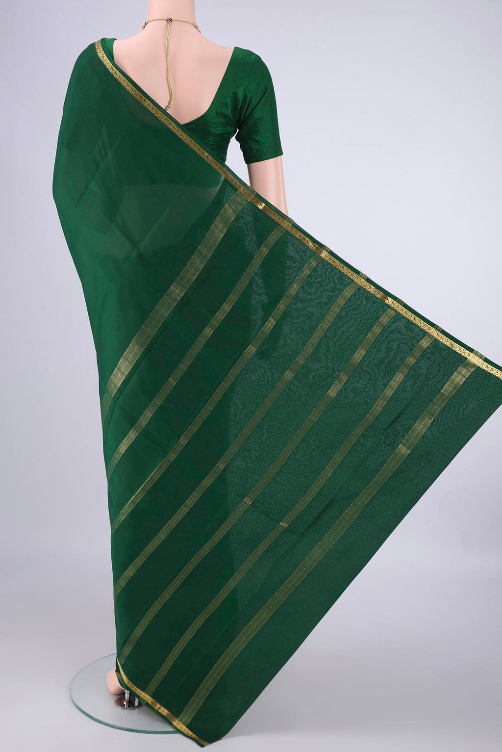 Flat view of Bottle Green Mysore Crepe Saree with Plain Body and Zari Border. 