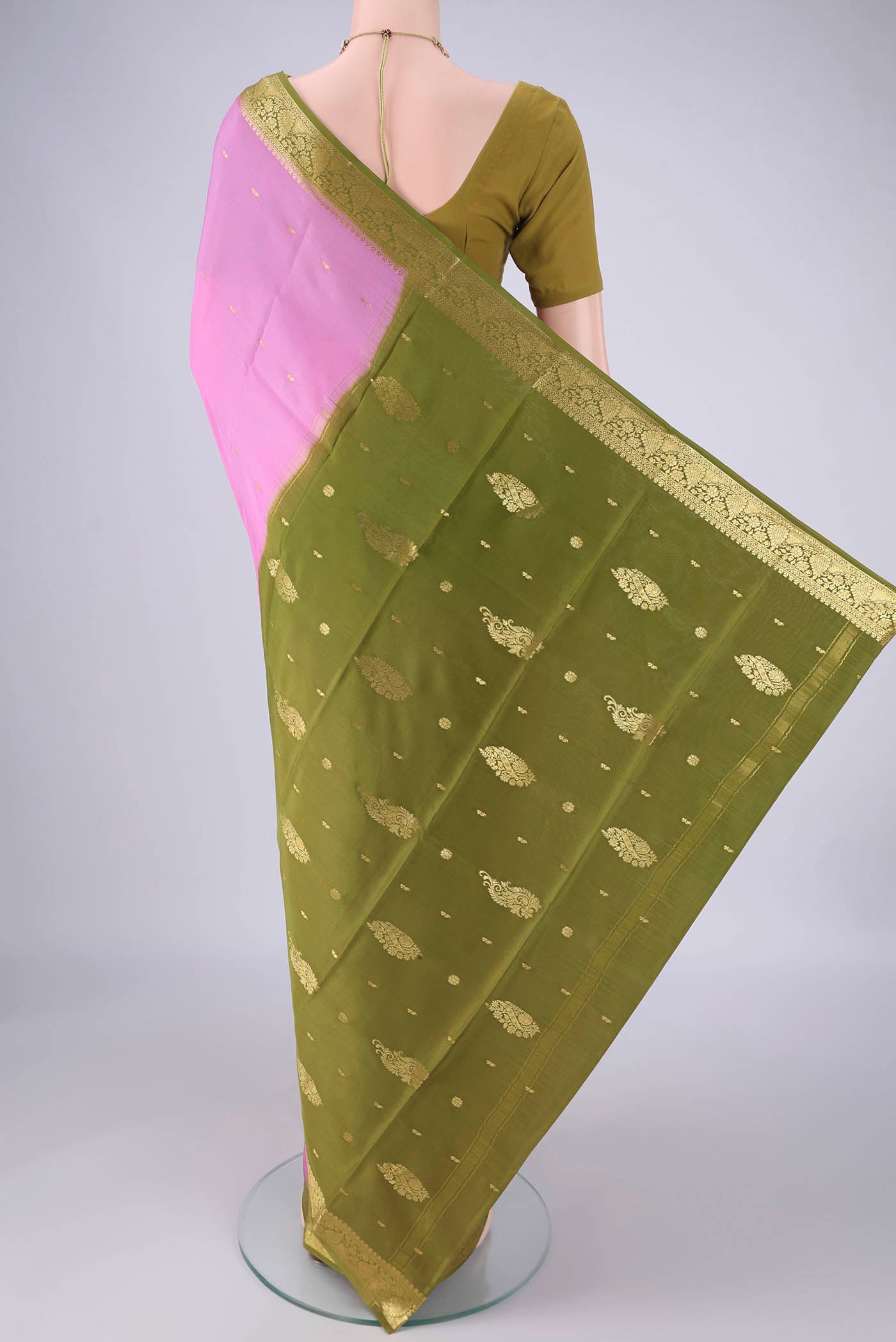 Flat view of Rose pink Mysore Crepe Saree with Zari Butta on the body and Zari Border. 