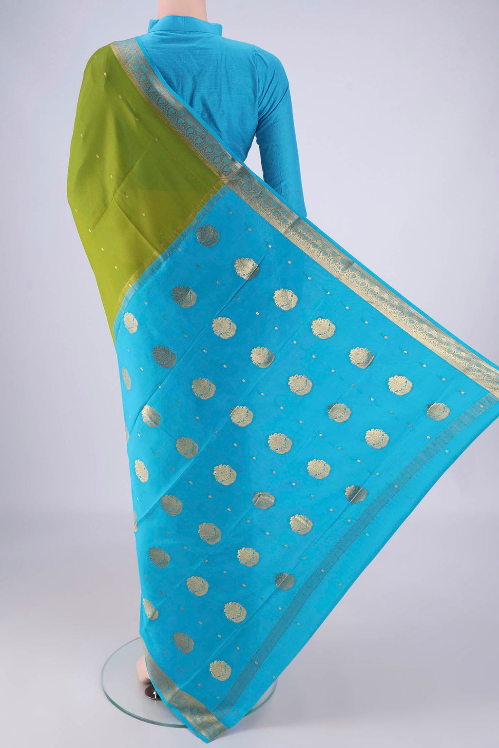 Flat view of Mehandi Green Mysore Crepe Saree with Zari Butta on the body and Zari Border. 