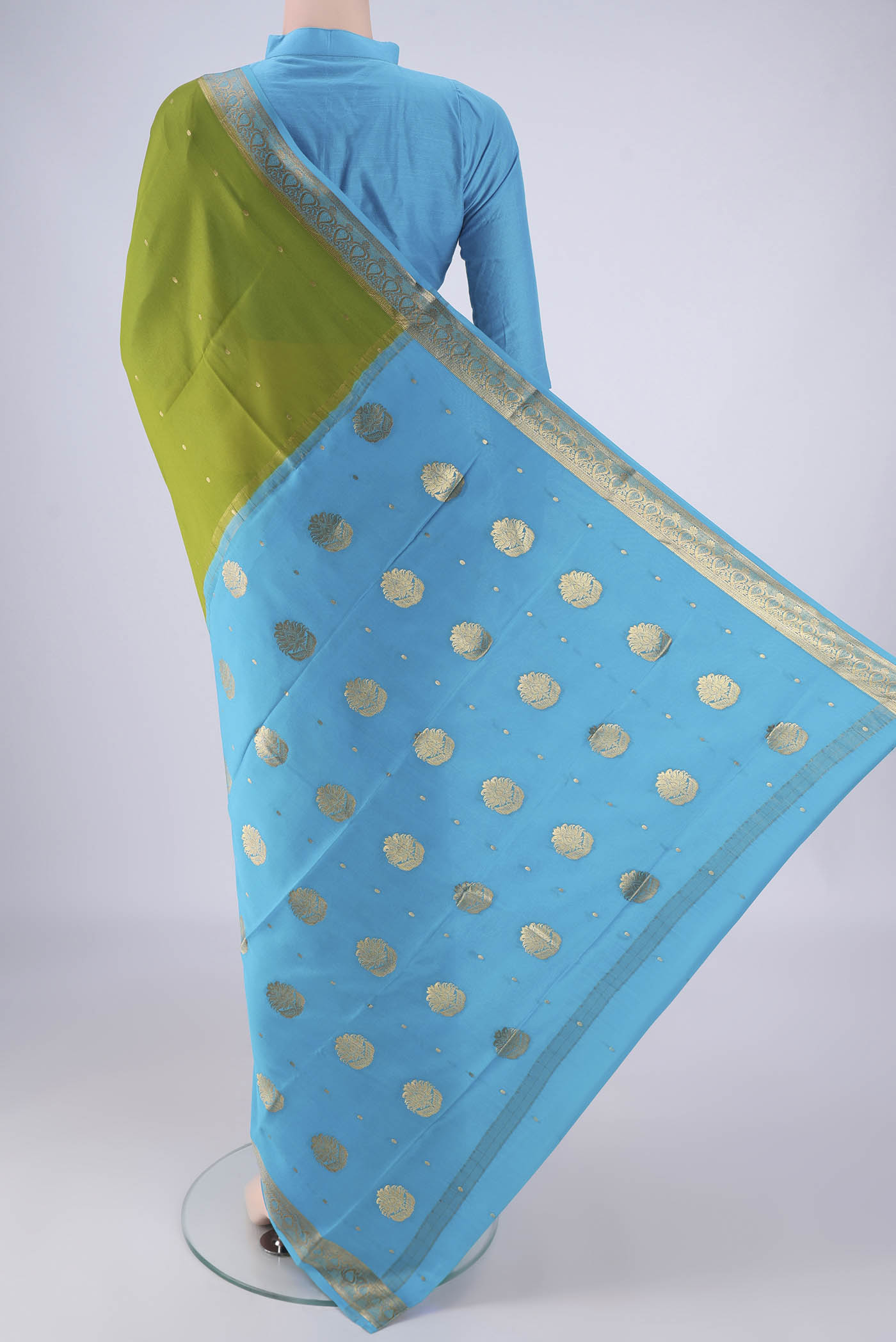 Flat view of Mehandi Green Mysore Crepe Saree with Zari Butta on the body and Zari Border. 