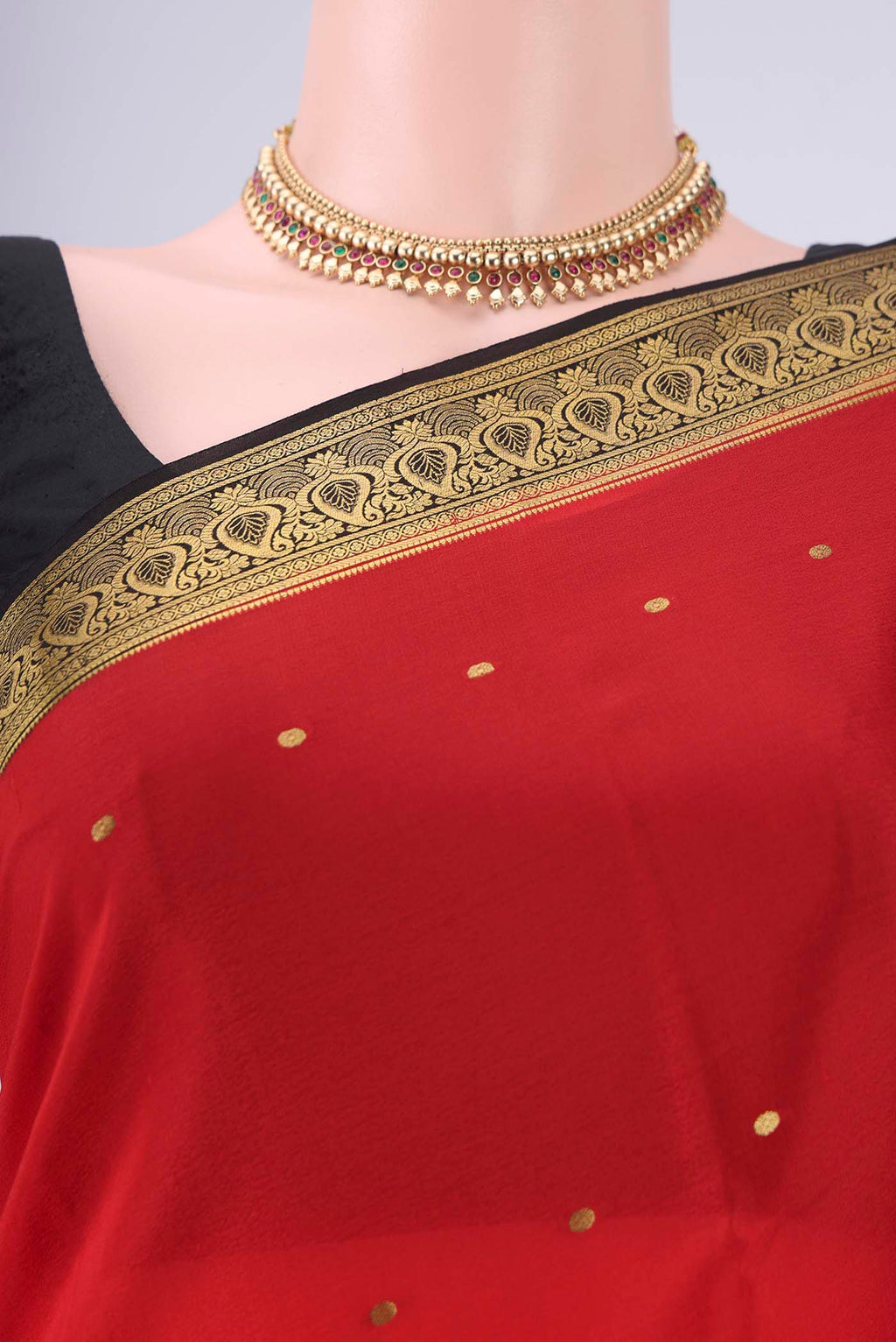 Border image of Red Mysore Crepe Saree with Zari Butta on the body and Zari Border. 