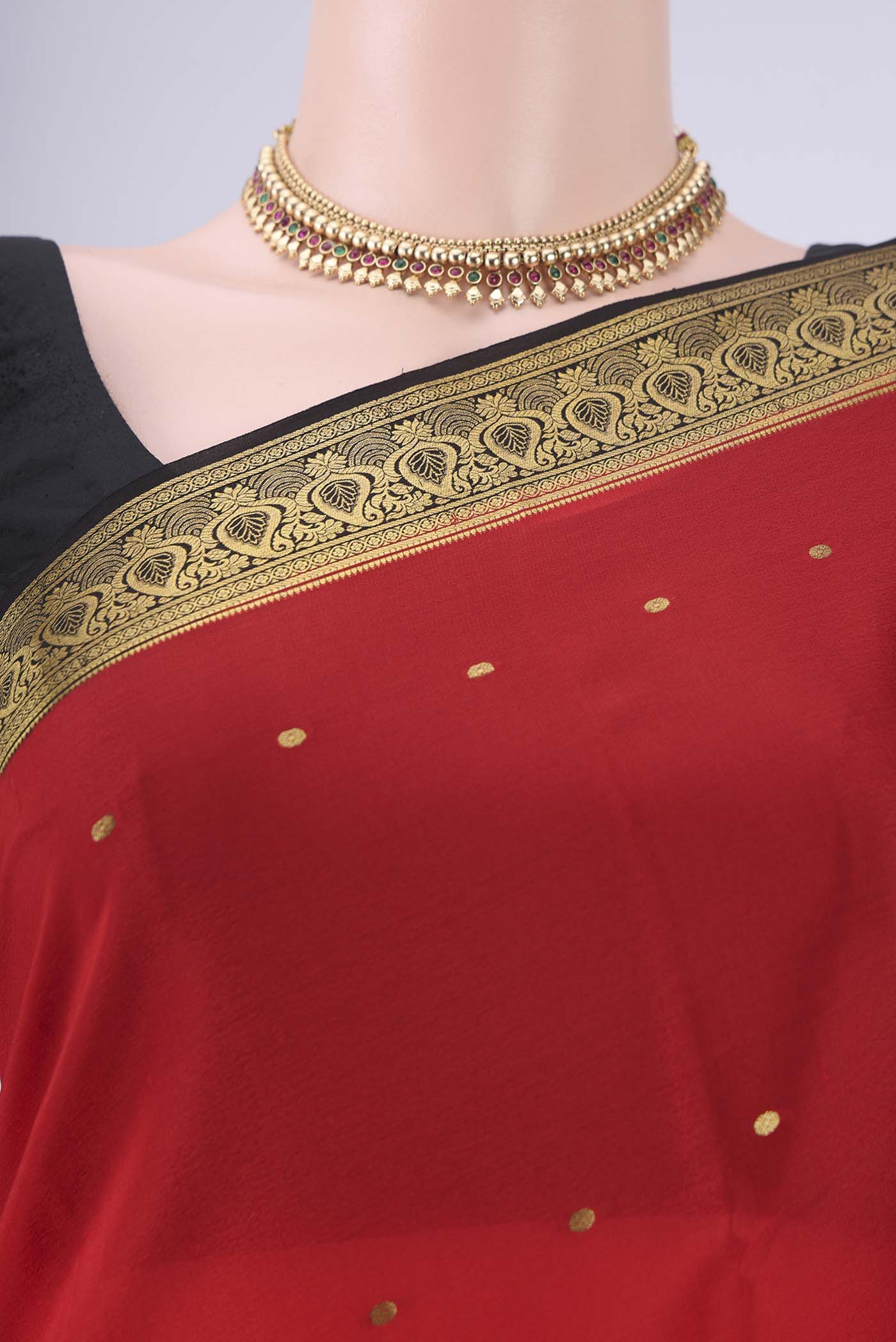 Border image of Red Mysore Crepe Saree with Zari Butta on the body and Zari Border. 