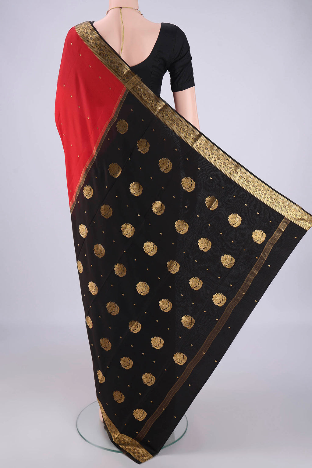 Flat view of Red Mysore Crepe Saree with Zari Butta on the body and Zari Border. 
