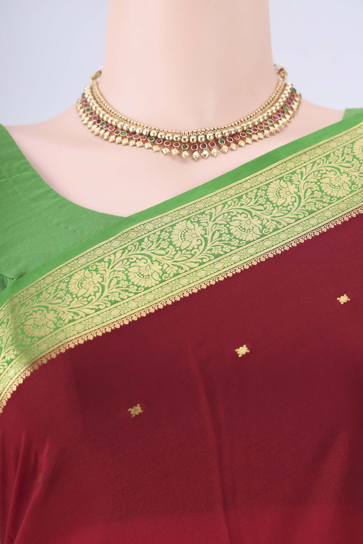 Border image of Maroon Mysore Crepe Saree with Zari Butta on the body and Zari Border. 