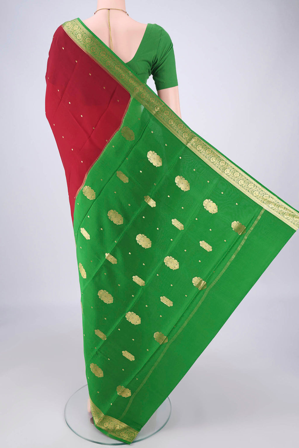 Flat view of Maroon Mysore Crepe Saree with Zari Butta on the body and Zari Border. 