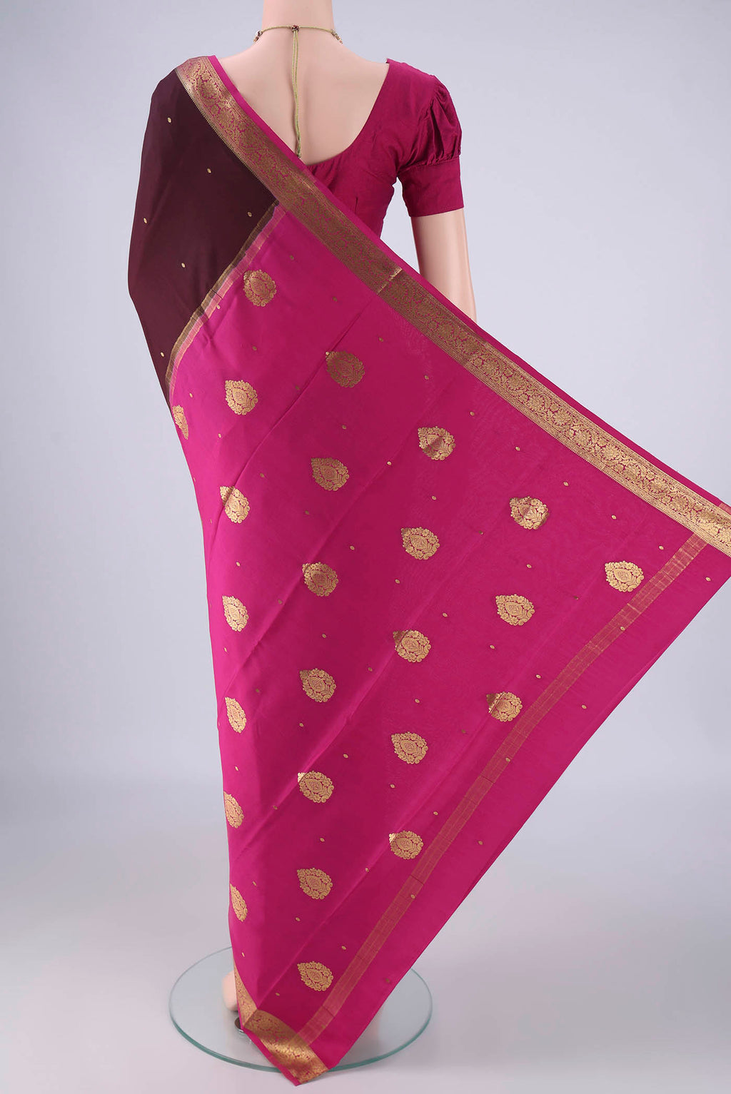 Flat view of Brown Mysore Crepe Saree with Zari Butta on the body and Zari Border. 