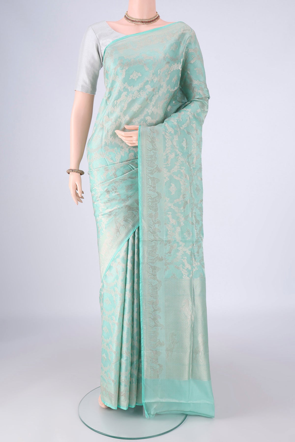 Light Blue Banarasi Silk Saree with Zari Brocade on the body and Zari Border.  displayed on a mannequin