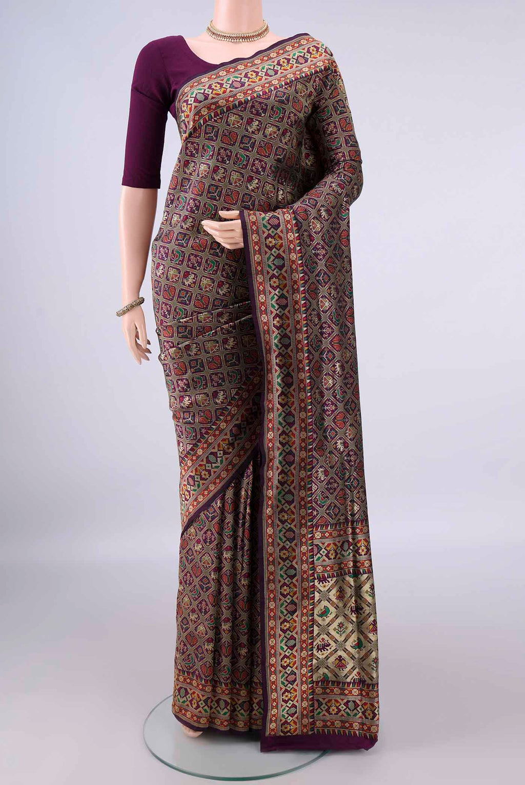 Pure Silk Purple Banarasi Saree with Zari And Thread Butta on the body and Zari Border.  displayed on a mannequin