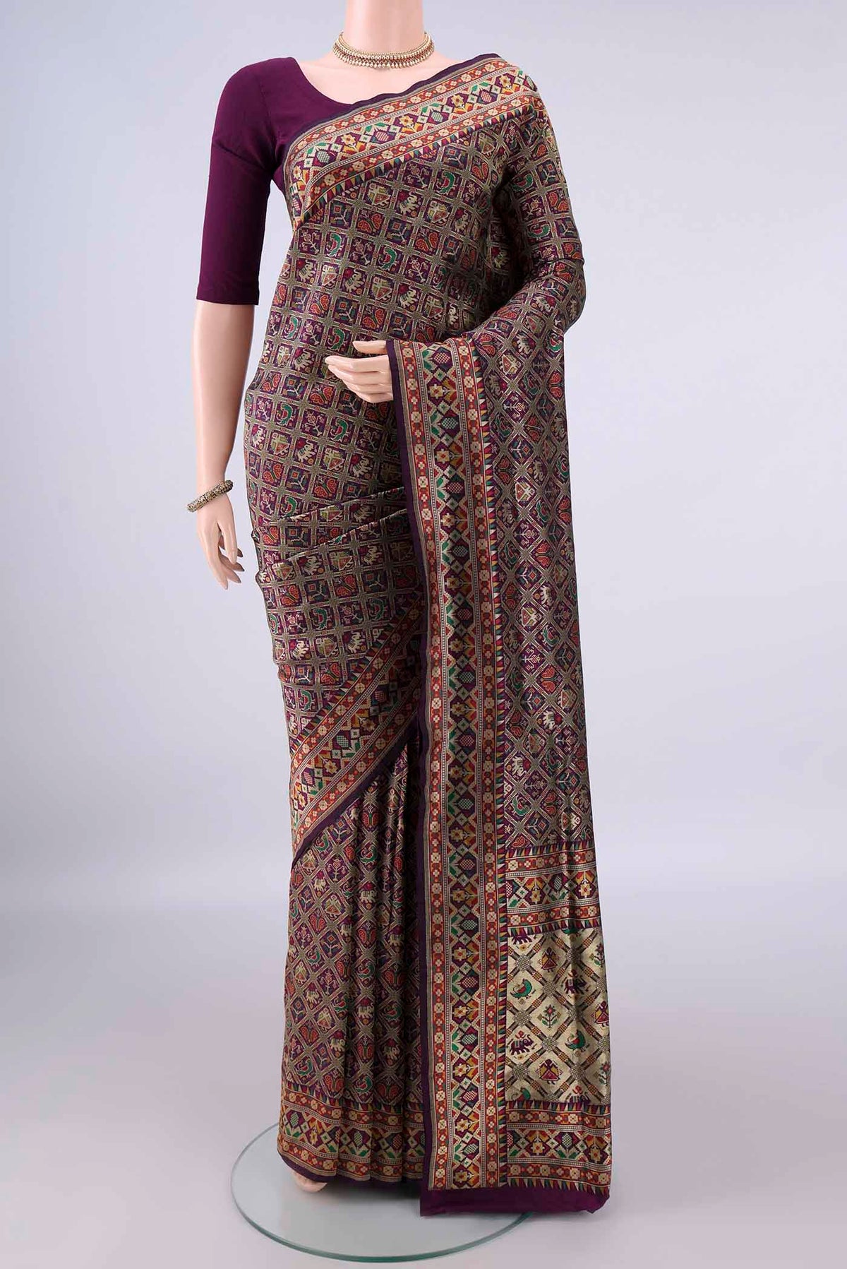 Pure Silk Purple Banarasi Saree with Zari And Thread Butta on the body and Zari Border.  displayed on a mannequin