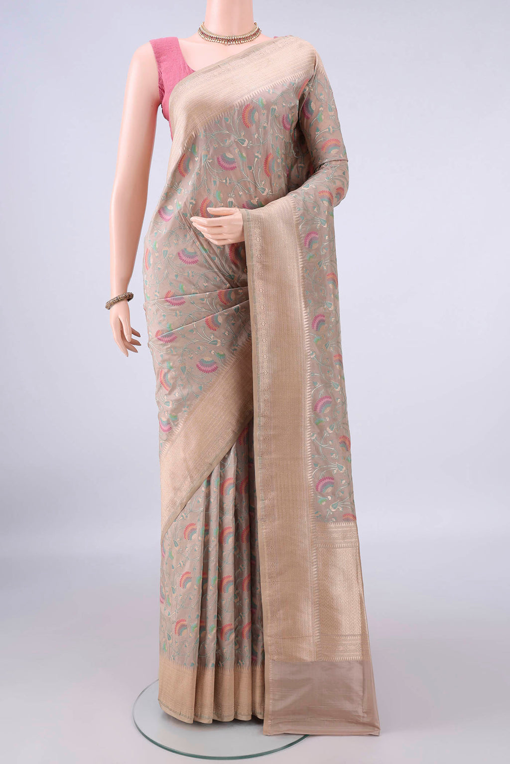Pure Silk Beige Banarasi Saree with Zari And Thread Butta on the body and Zari Border.  displayed on a mannequin