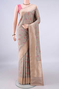 Pure Silk Beige Banarasi Saree with Zari And Thread Butta on the body and Zari Border.  displayed on a mannequin