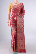 Rust Banarasi Tussar Saree with Zari Brocade on the body and Zari And Thread Border.  displayed on a mannequin