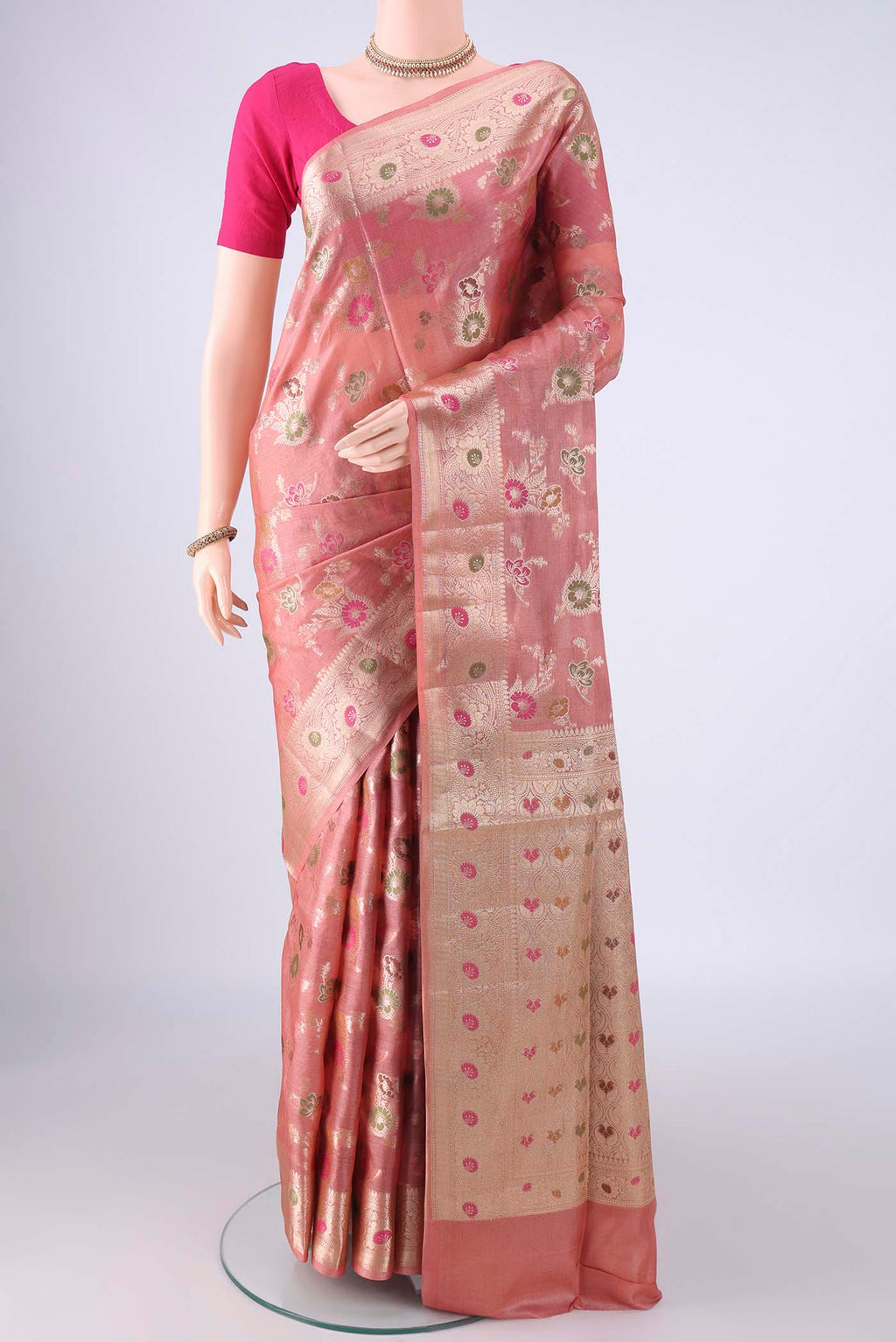 Rose Gold Banarasi Tussar Silk Saree with Zari And Thread Butta on the body and Zari Border.  displayed on a mannequin