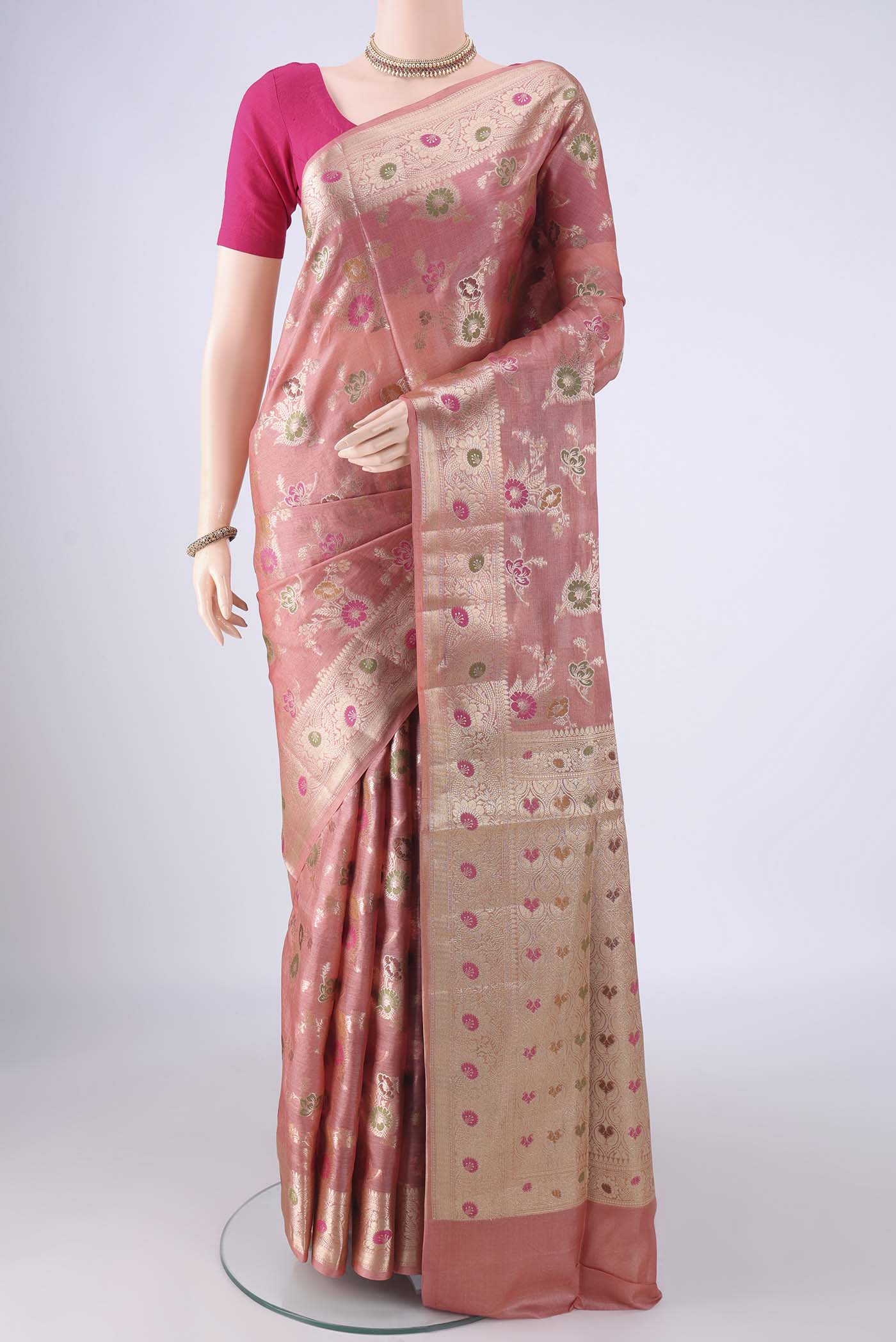 Rose Gold Banarasi Tussar Silk Saree with Zari And Thread Butta on the body and Zari Border.  displayed on a mannequin