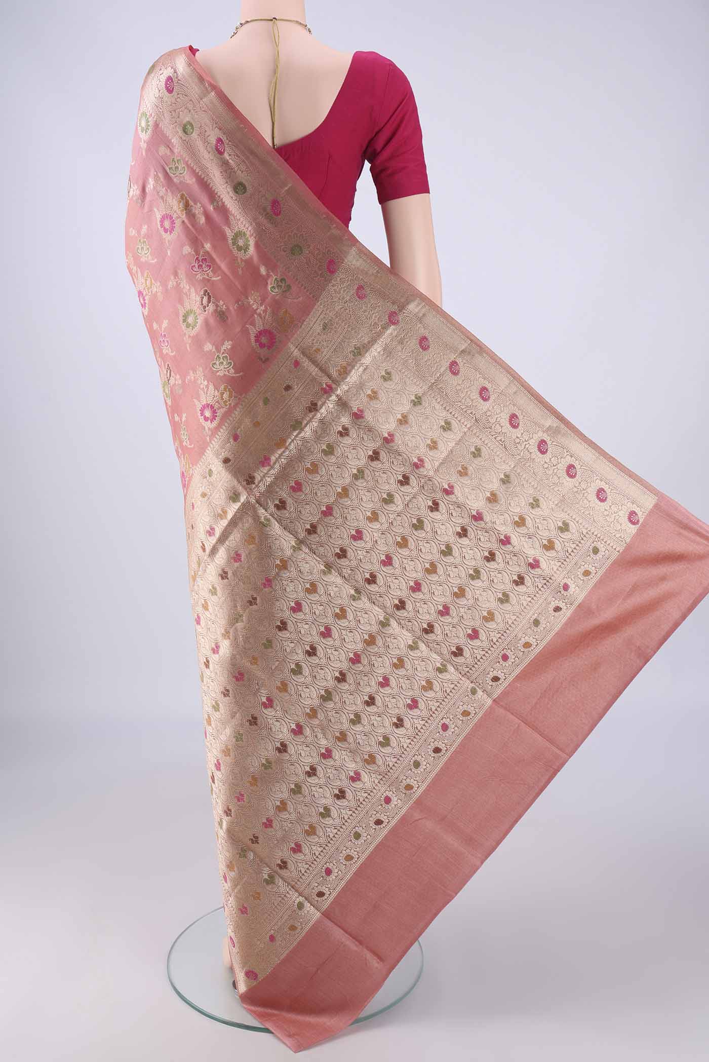 Flat view of Rose Gold Banarasi Tussar Silk Saree with Zari And Thread Butta on the body and Zari Border. 