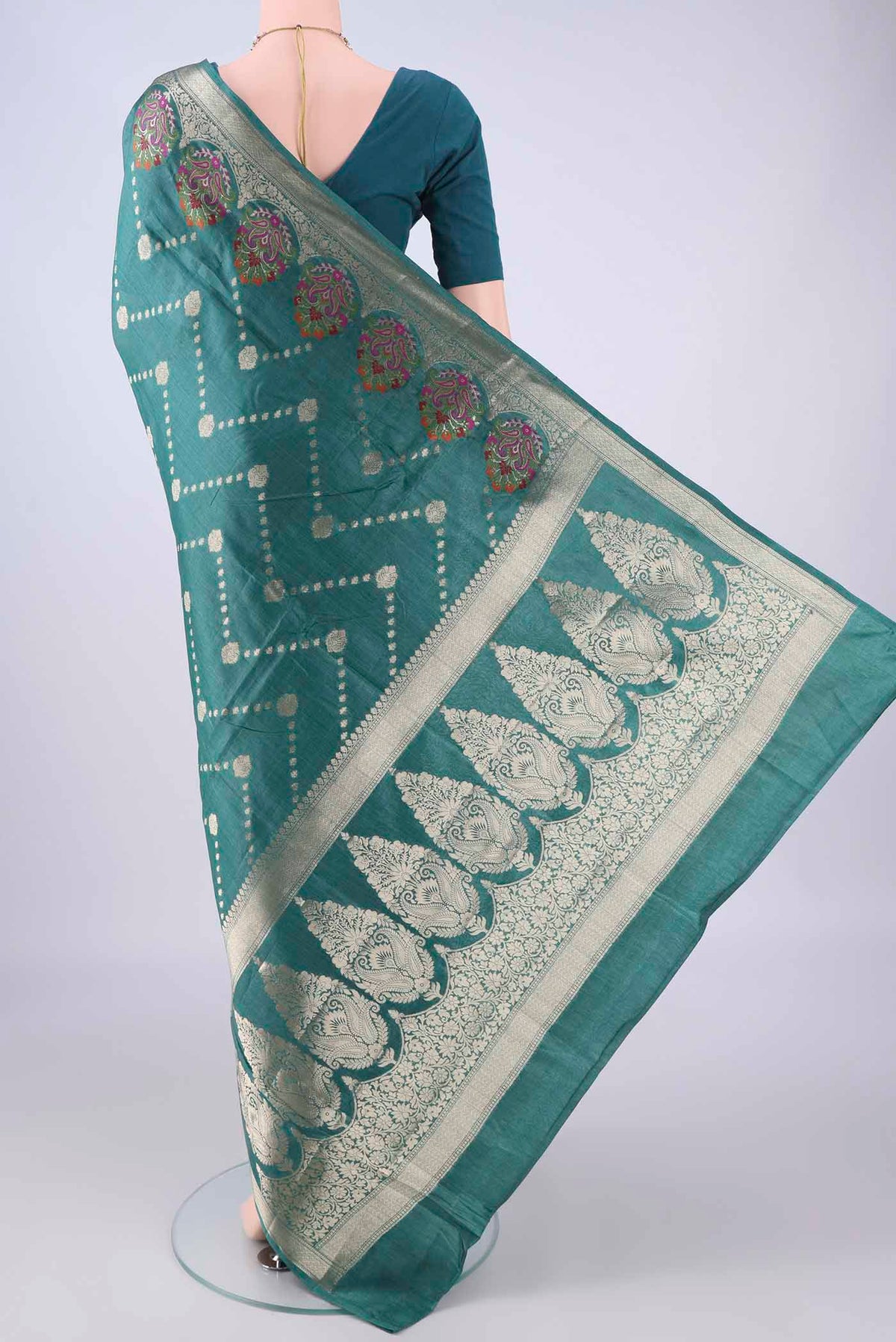 Flat view of Sea Green Banarasi Tussar Silk Saree with Zari And Thread Butta on the body and Zari Border. 