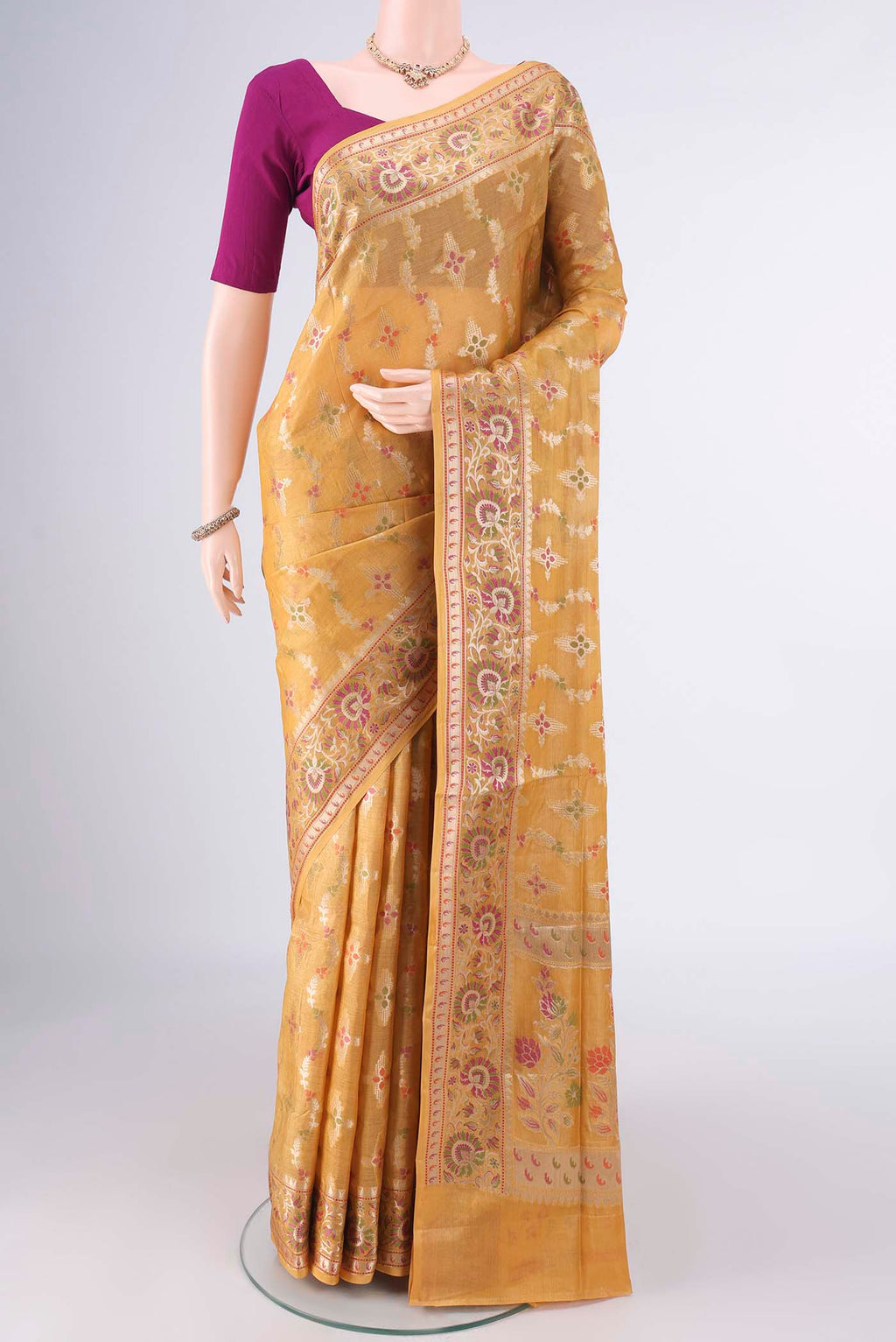 Mustard Banarasi Tussar Saree with Zari And Thread Butta on the body and Zari And Thread Border.  displayed on a mannequin