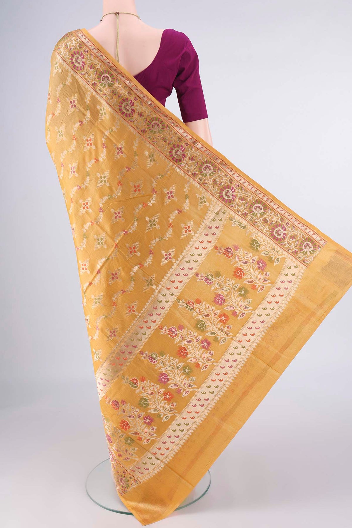 Flat view of Mustard Banarasi Tussar Saree with Zari And Thread Butta on the body and Zari And Thread Border. 