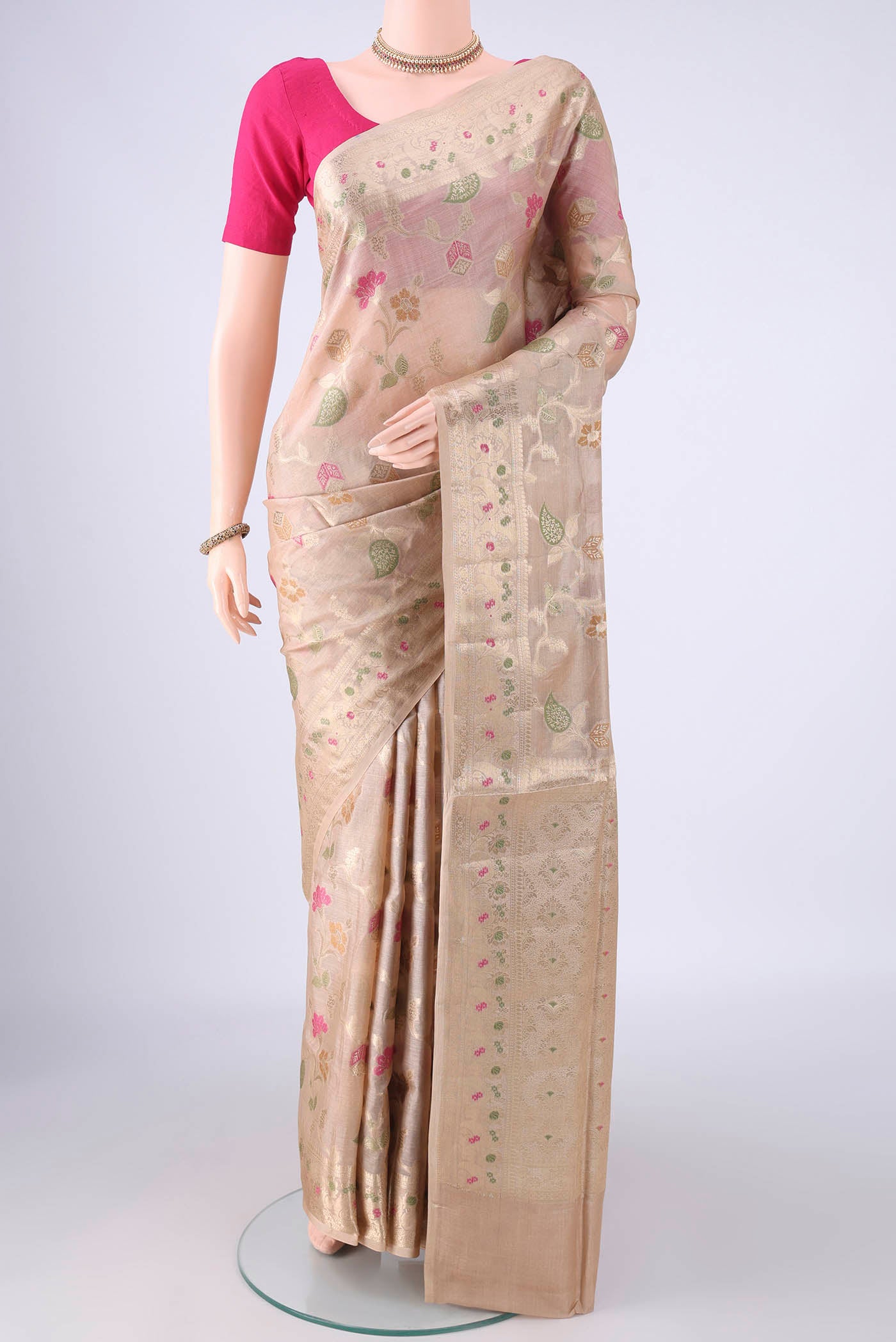 Beige Banarasi Tussar Silk Saree with Zari And Thread Butta on the body and Zari Border.  displayed on a mannequin