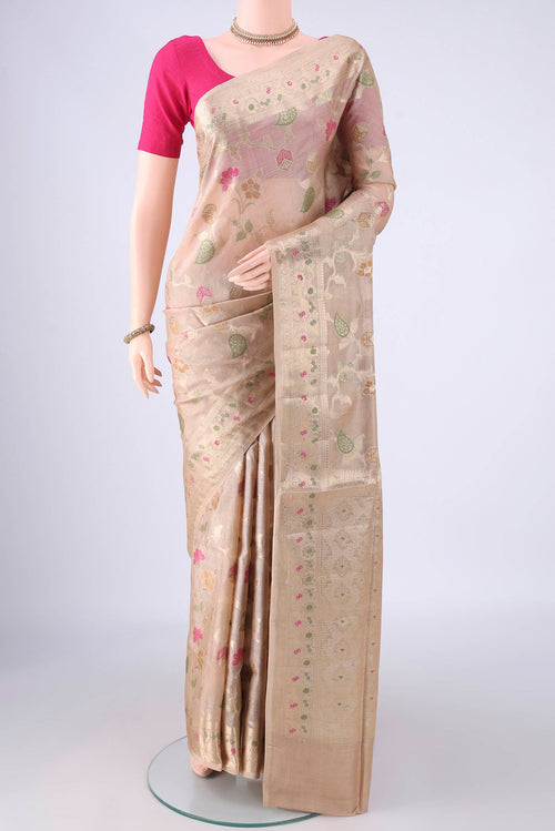 Beige Banarasi Tussar Silk Saree with Zari And Thread Butta on the body and Zari Border.  displayed on a mannequin