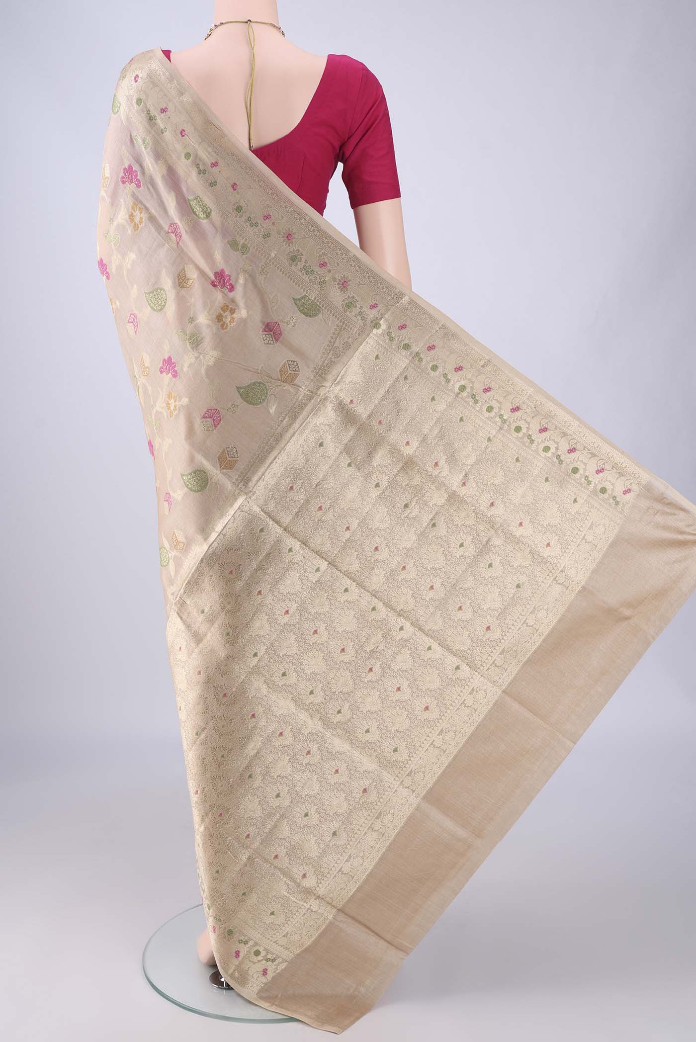 Flat view of Beige Banarasi Tussar Silk Saree with Zari And Thread Butta on the body and Zari Border. 