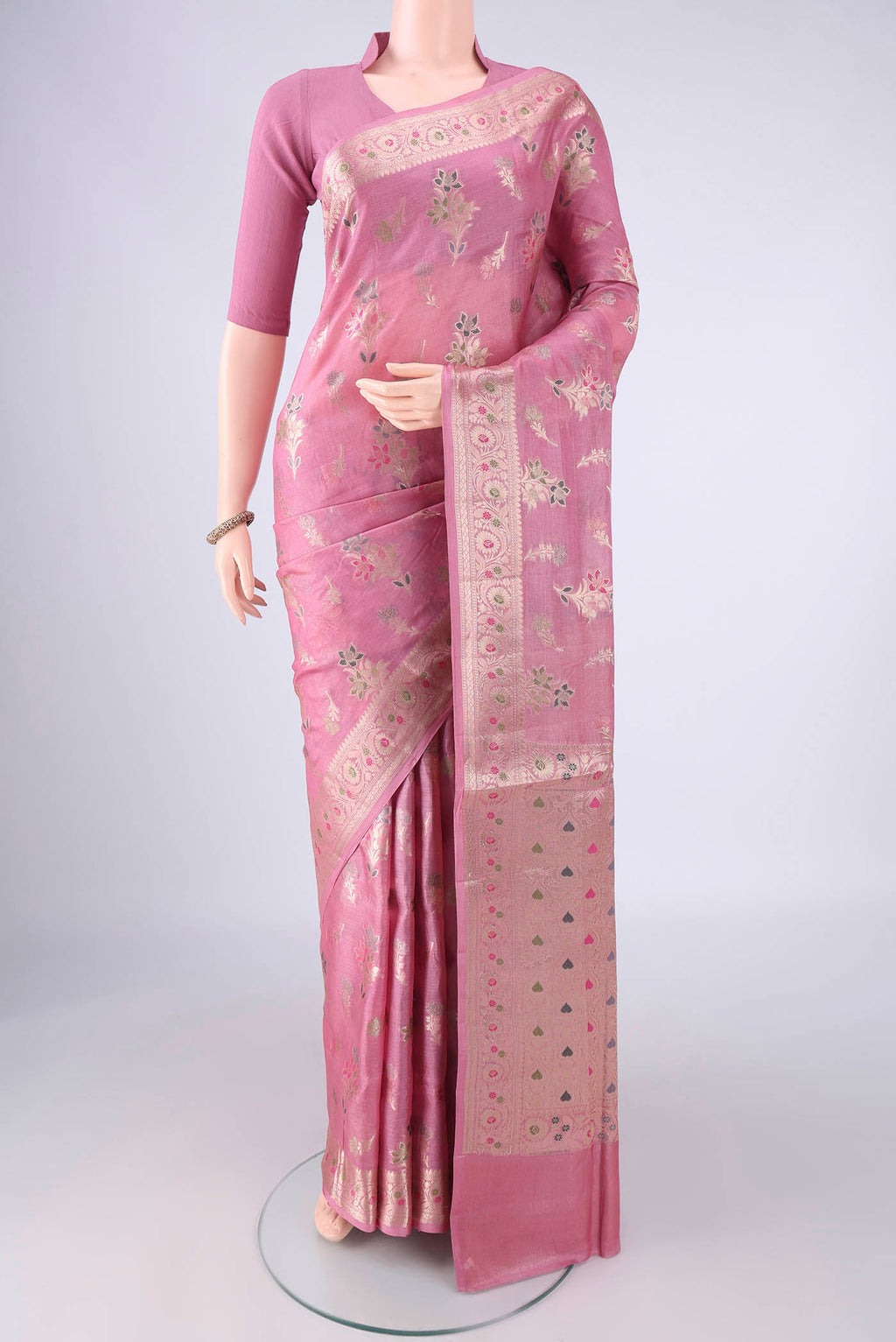 Rose pink Banarasi Tussar Silk Saree with Zari And Thread Butta on the body and Zari Border.  displayed on a mannequin