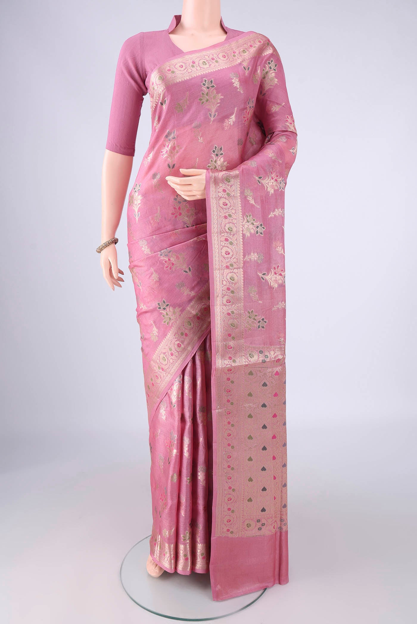 Rose pink Banarasi Tussar Silk Saree with Zari And Thread Butta on the body and Zari Border.  displayed on a mannequin