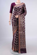 Pure Silk Burgundy Banarasi Raw Saree with Zari And Thread Butta on the body and Zari Border.  displayed on a mannequin