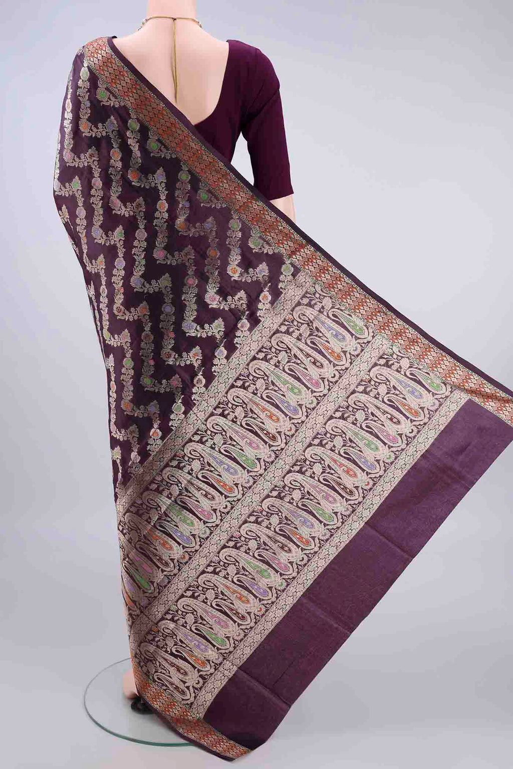 Flat view of Pure Silk Burgundy Banarasi Raw Saree with Zari And Thread Butta on the body and Zari Border. 