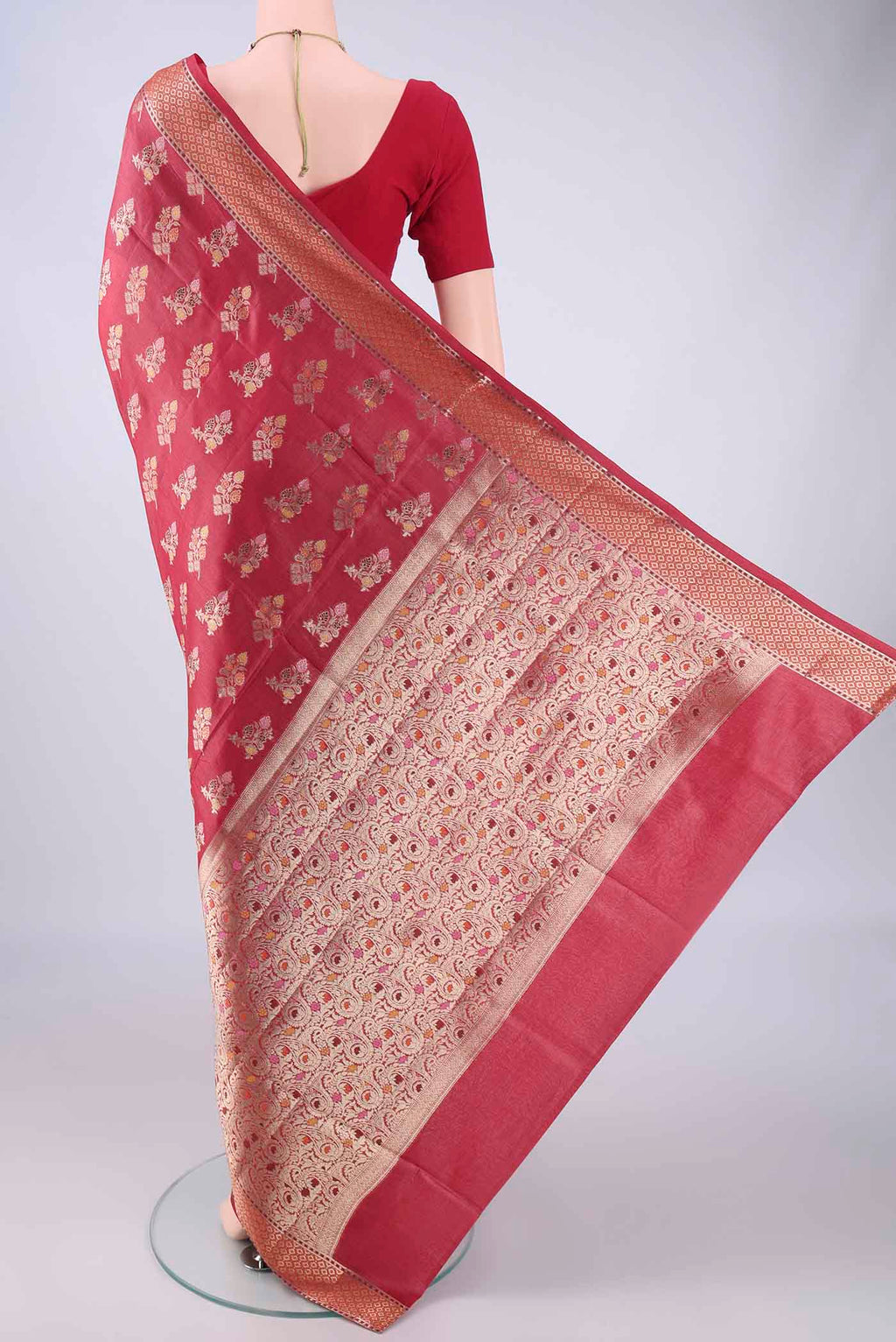 Flat view of Coral Banarasi Tussar Silk Saree with Zari And Thread Butta on the body and Zari Border. 